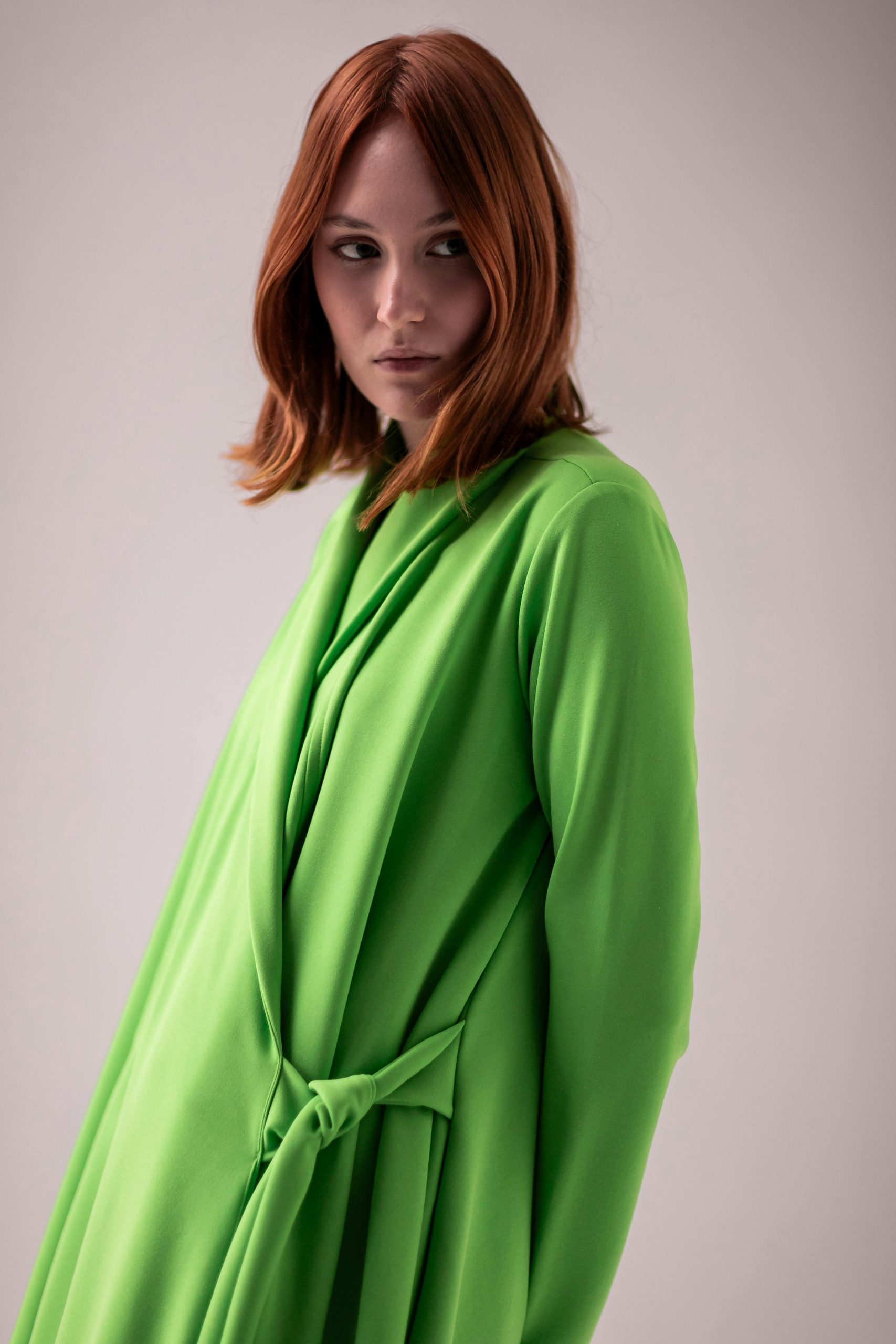 Bright green draped belted dress